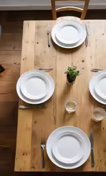 the place settings are laid out on the table