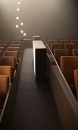 an empty auditorium with some yellow seats and light bulbs