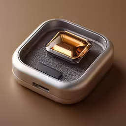the electronic device has a metal frame and some golden things inside it