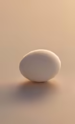 an egg is seen on a pale background