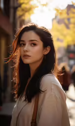 a beautiful young woman standing in the sun