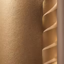 gold colored wall coverings in a hallway with black floor