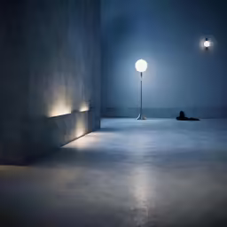 a person laying on the ground under two lights