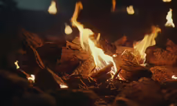 flames lit at night as a fireplace burns