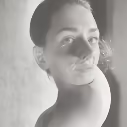 a black and white photo of a woman with no shirt