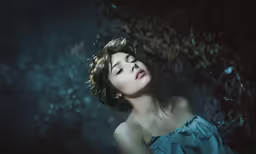 the woman is wearing a hairpiece posing for the camera