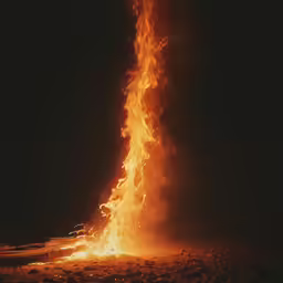 the fire is on the ground and it looks like it has many burners