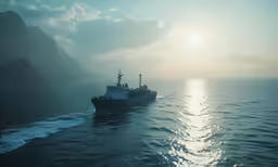 the ship is anchored at the beach while the sun goes down