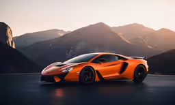an orange sports car sitting on top of a parking lot