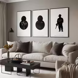 a living room filled with white couches and paintings