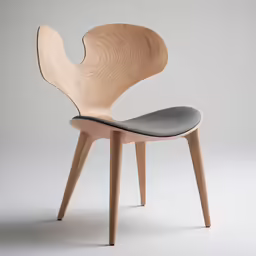 the side view of an eco - conscious and wooden chair with grey leather seat