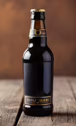 a bottle of alcohol sitting on a wooden table