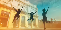 three people are jumping outside on a street