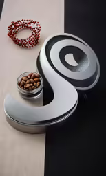 a coffee cup sitting next to an interesting object