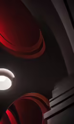 red and white lights in an indoor arena with concrete stairs