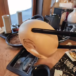 there is a large bowl that is shaped like an onion on the kitchen counter