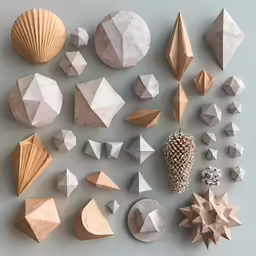 the shapes of folded paper and wood are arranged neatly