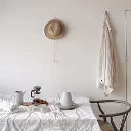 an image of a table setting with coffee cups