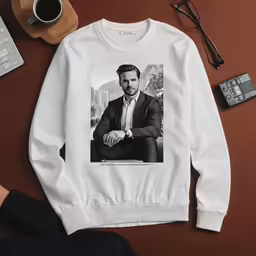 a white sweatshirt that is on a desk