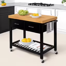 a kitchen island with two bowls of fruit