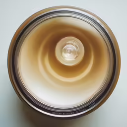 a white and silver saucer on the table