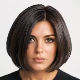 a close up of a person with a short haircut