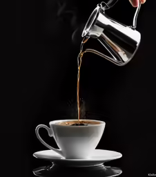 the coffee being poured into the cup