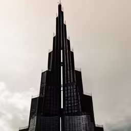 a tall clock tower sitting under a cloudy sky