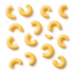 a bunch of macaroni curls that are yellow