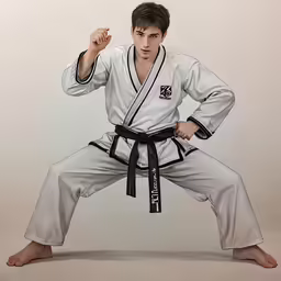 a man with black belt in white kimono holding his hands out