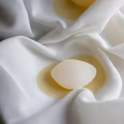 an image of some soap like substance sitting on a blanket