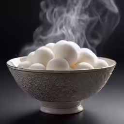 the smoke is coming out from behind a bowl of cotton balls