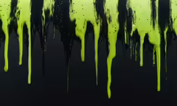 a black and green paint drips down on the floor