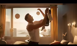 a man in white shirt holding onto an item