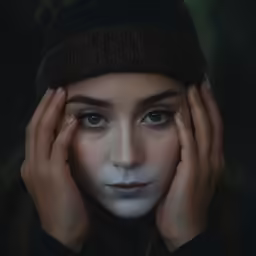 an artistic portrait of a young woman with blue eyes
