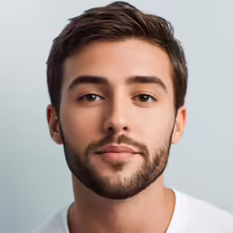 man looking straight ahead with hair trimmed in side part