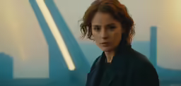 the young girl is staring at the camera