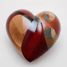 a wooden heart shaped with two hearts on each one