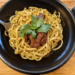 a close up of a plate of food with noodles
