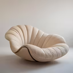 a living room filled with an egg chair