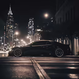 a car that is sitting in the street at night