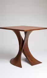 a wooden table with two long curved legs