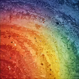 the rain is hitting a window with colorful colored water