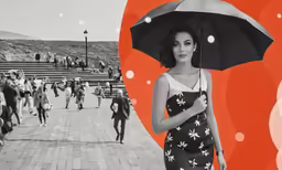black and white photo of a woman with a flowered umbrella