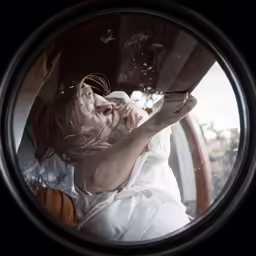 the reflection of a person making gestures with his finger