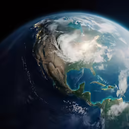 the earth with clouds and sunlight from space
