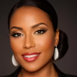 an african american woman with natural make - up and earrings