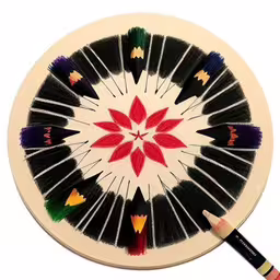 a dart and a small dart in front of a white backdrop,an artistically painted dart on the white back ground