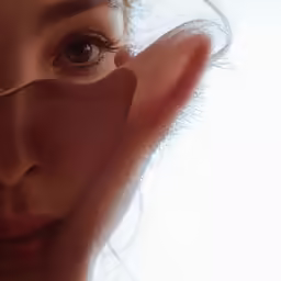 a woman has very small objects to hide behind her eyes