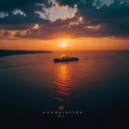 a large ship at sunset on the ocean